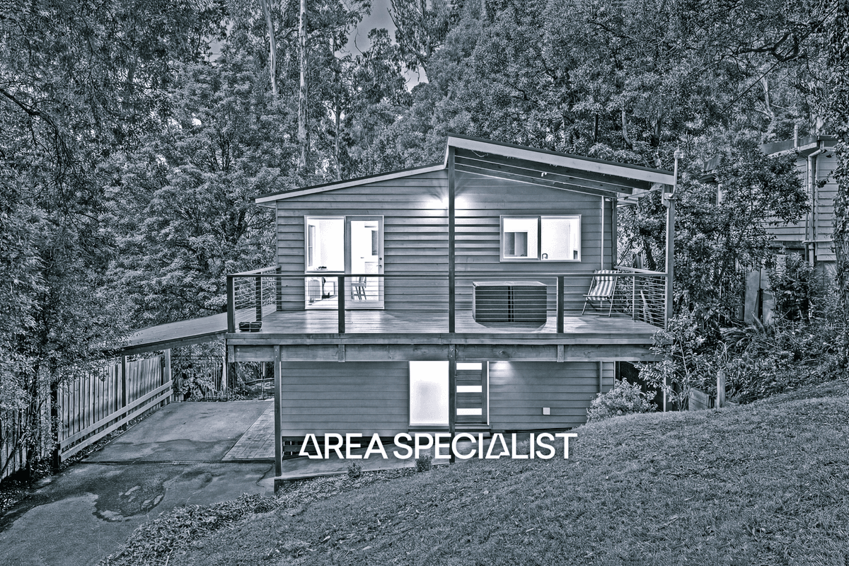 6 Durang Road, Upwey: a weatherboard home with a covered balcony among trees